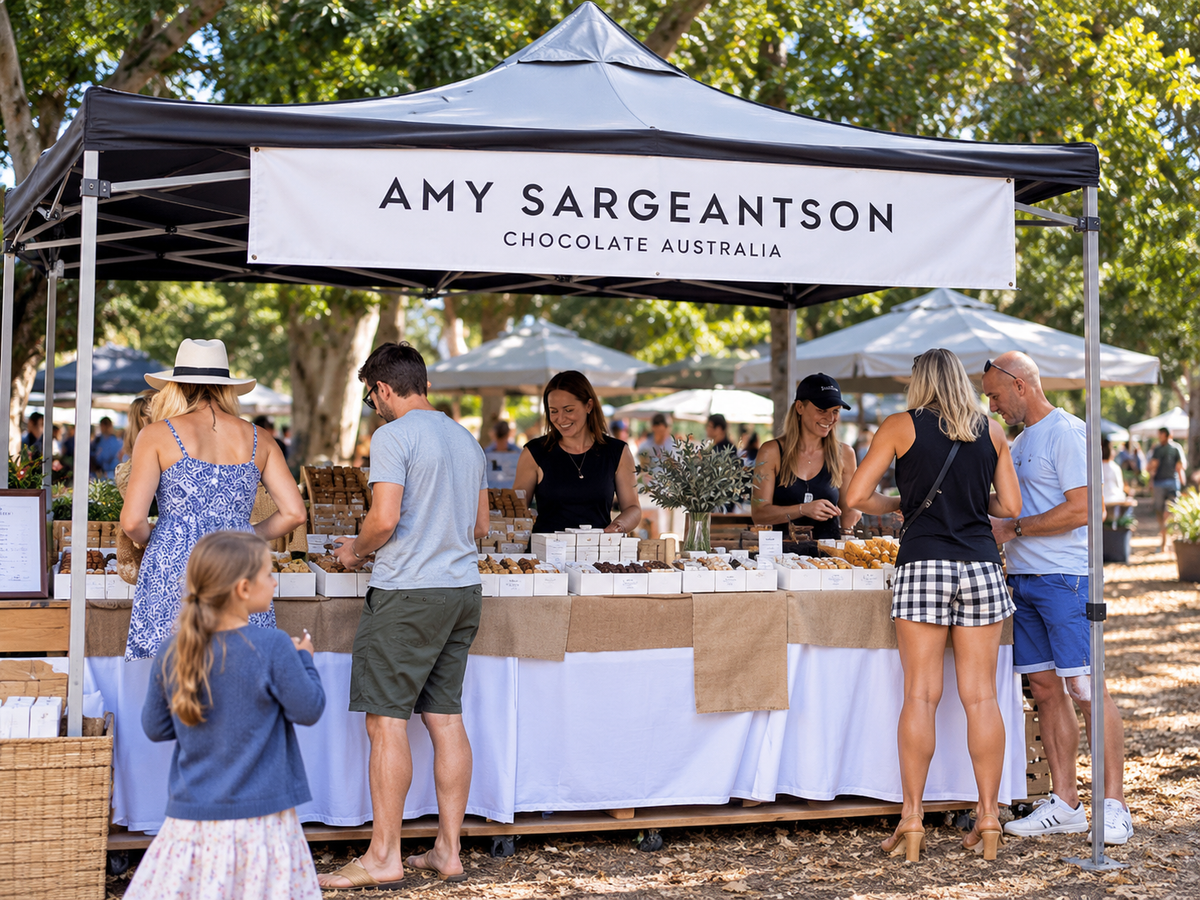 HD still of Amy Sargeantson market stall with customers